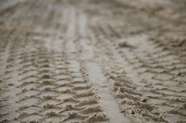 Sandy road tire track. Close-up view. Background and texture.
