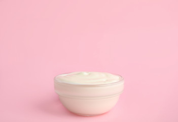 Tasty organic yogurt on pink background. Space for text