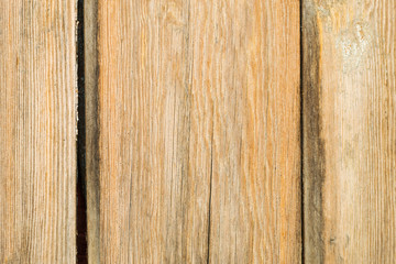 Old brown wooden background with vertical boards.