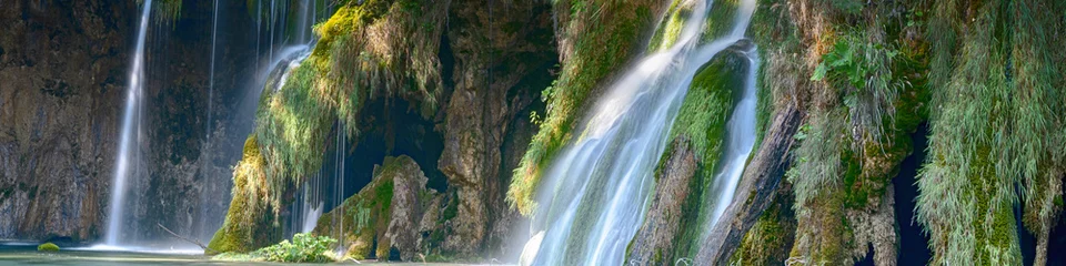 Foto auf Acrylglas Panoramic waterfall in the forest. Exotic waterfall and lake landscape of Plitvice Lakes National Park, UNESCO natural world heritage and famous travel destin Crystal clear water and natural cascade.  © emotionpicture