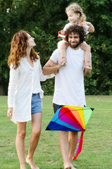 Fototapeta premium Happy young family in the park