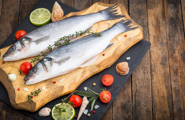 Fresh raw seabass fishon the wooden table