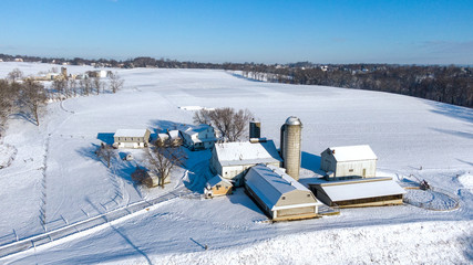 Aerial view of farm in winter, snow covered landscape, Lancaster county, Pennsylvania