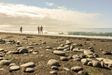 stones on black sand beach