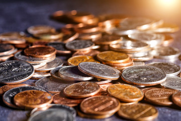 American coins and us dollars on a black table. Various USA coins, American coins for business, money, financial coins and economy