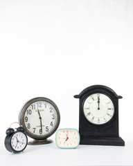 Multiple clocks isolated on a white background