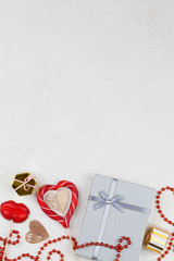 red lollipops, decoration , gifts and ribbon on white background. Valentines day background.