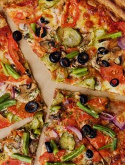 Delicious pizza with mushrooms and tomatoes macro