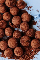 Delicious truffles with cocoa on a plate
