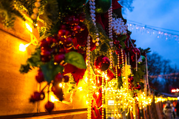 Christmas decorations and garlands on the street, illuminated winter holiday city decor
