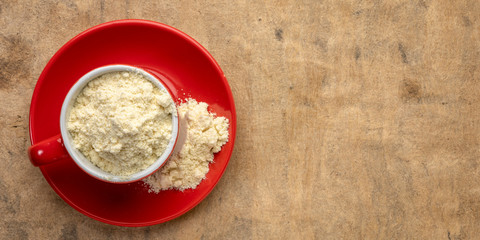 whey protein powder in a coffee cup