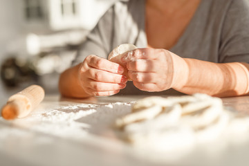 cooking traditional national dish, yeast dough, flour, women hands