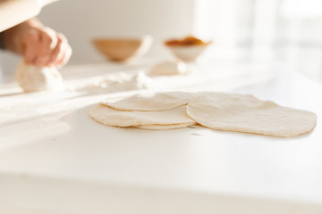 cooking traditional national dish, yeast dough, flour, women hands