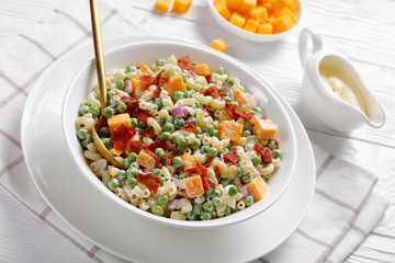 elbow macaroni salad with green peas, close-up
