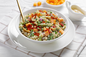elbow macaroni salad with green peas, close-up