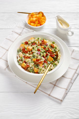 pasta salad with green peas, fried bacon