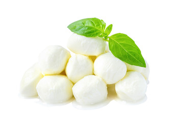 Heap of mini mozzarella cheese balls and basil isolated on white background. Healhy mediterranean cuisine and vegetarian food. - obrazy, fototapety, plakaty