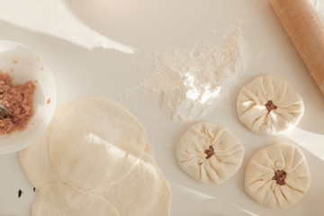 cooking traditional national dish, yeast dough, flour, women hands