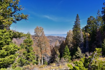Rocky Mountain Wasatch Front peaks, panorama landscape view from Butterfield canyon Oquirrh range by Rio Tinto Bingham Copper Mine, Great Salt Lake Valley in fall. Utah, United States.