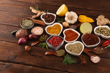 Spices and herbs on table. Food and cuisine ingredients and lemon