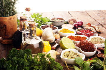 Spices and herbs on table. Food and cuisine ingredients with oil and vinegar