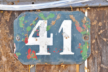 A house number plaque, showing the number fourty one (41)