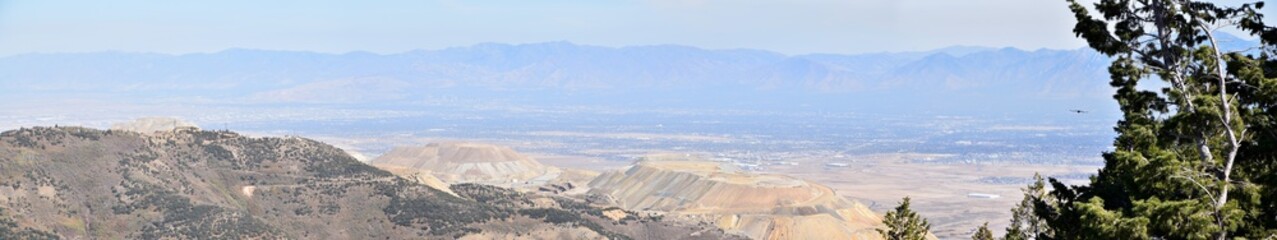 Rocky Mountain Wasatch Front peaks, panorama landscape view from Butterfield canyon Oquirrh range by Rio Tinto Bingham Copper Mine, Great Salt Lake Valley in fall. Utah, United States.