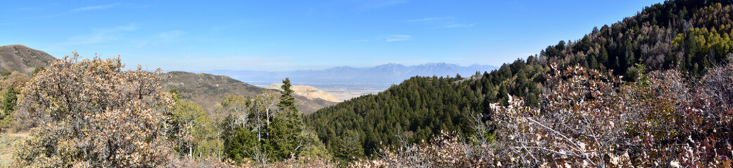 Fototapeta na wymiar Rocky Mountain Wasatch Front peaks, panorama landscape view from Butterfield canyon Oquirrh range by Rio Tinto Bingham Copper Mine, Great Salt Lake Valley in fall. Utah, United States.