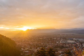 Landscape with aerial view of Rasnov town at sunset, Brasov, Transylvania, Romania