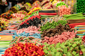 unhealthy but tasty colorful marmalade candies with a lot of sugar food background top view photography of market counter ready for selling