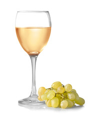 Glass of wine and grapes on white background