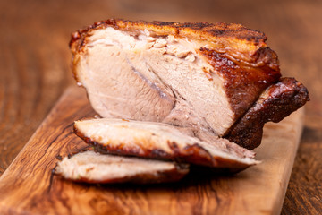 sliced bavarian roasted pork on wood