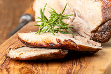 sliced bavarian roasted pork on wood