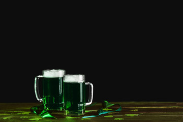Mugs of green beer on table. St. Patrick's Day celebration