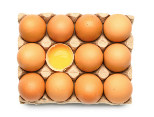 Package with fresh eggs on white background