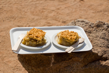 Plate with two pieces of delicious apple pie on the tray, closeup. Namibia, Solitaire: an apple pie...