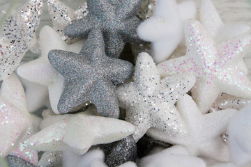 Decorative volume stars in glitter and sparkles. Light gentle christmas background