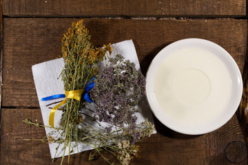 Alternative medicine and cosmetology. Olive oil is poured on a saucer. Nearby on a napkin are...