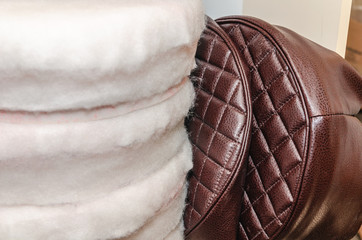Seat upholstery in a furniture workshop, eco-leather cover