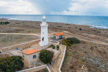 Fototapeta na wymiar Paphos Lighthouse, Cyprus, aerial view from drone. Located in Paphos archeological park on mediterranean seaside or coast, built in 1888.