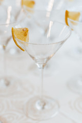 empty glasses at a wedding party on the table for cocktails with lemon slices