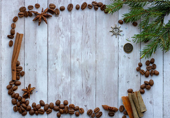 Fragrant coffee beans and hazelnuts. Spices cinnamon, star anise and cloves. Decorations for Christmas and New Year. Background mode. Winter decor.