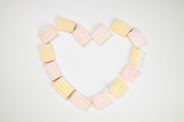 candy marshmallow heart shape with empty center. sweet backdrop for holiday events. pastel colors.
