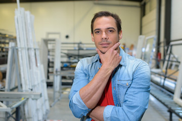 portrait of a young man in factory