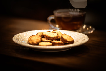 Tea cups with thin cream wafers. Teas with hot smoke. Fine cookies with accompanying special teas.