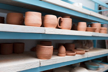 Fototapeta na wymiar Many different ceramic items on store shelves