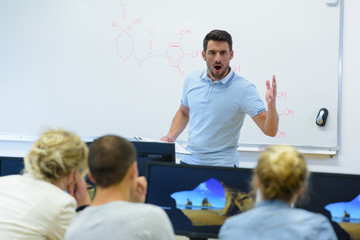 angry screaming male teacher pointing out