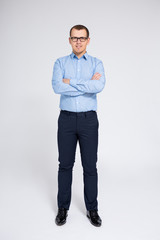 full length portrait of businessman over gray background