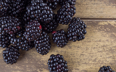 Fresh blackberries on a wooden background - 309851225