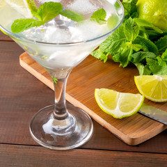 Summer mint lime refreshing cocktail mojito with rum and ice in glass - 309851287